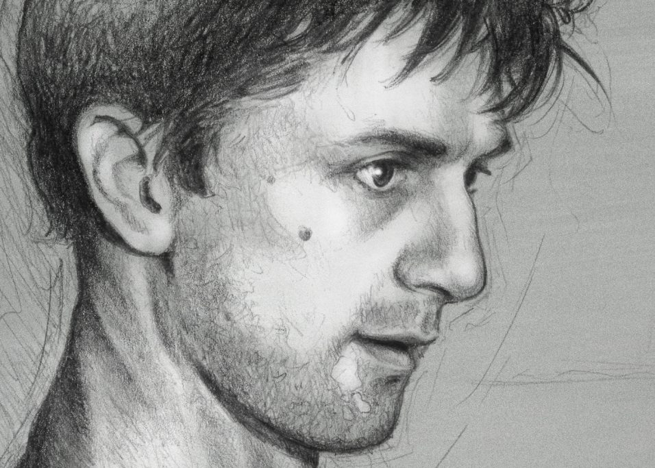 Robert DeNiro - close up Portrait eines jungen Mannes in Profilansicht, mit kurzen Haaren und ernster Miene.