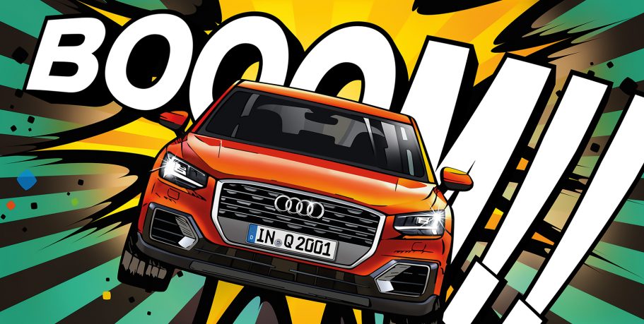 Ein orangefarbener Audi fährt mit einer Comic-Explosion im Hintergrund.